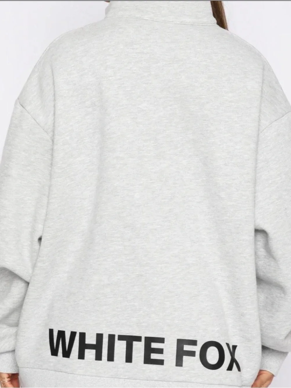 White Fox quarter zip sweater Size S/M fits up to a Large